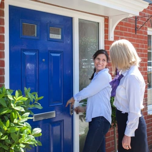 People entering a new home via the front door
