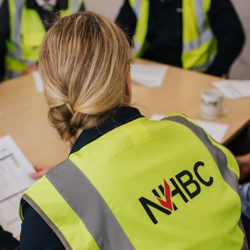 A group of NHBC employee in reflective vests during immersive days