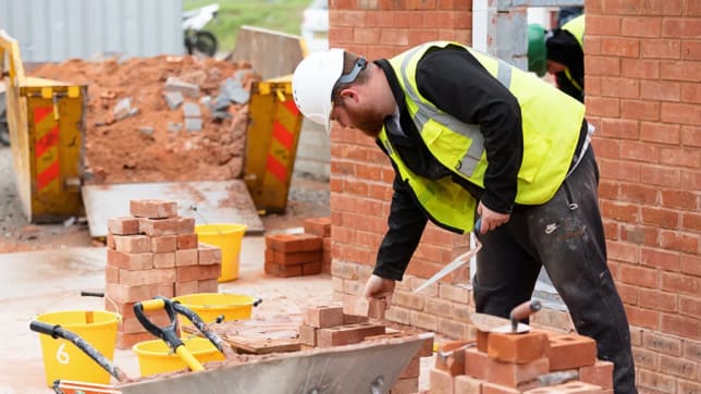 A photo of a bricklayer at work on site