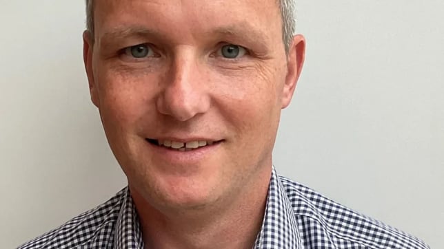 paul cribbens in a chequered shirt smiling at the camera