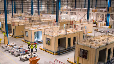 a photo of a warehouse containing training construction rooms