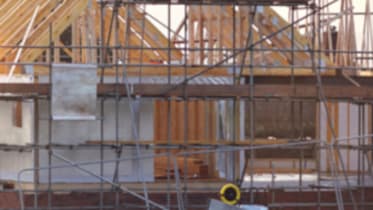 a building under construction surrounded by scaffolding