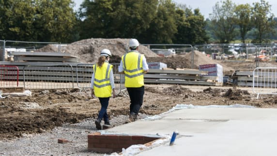 a photo of two apprentices on site