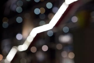Blurred photo of luminous points, of which a set represents the shape of a staircase