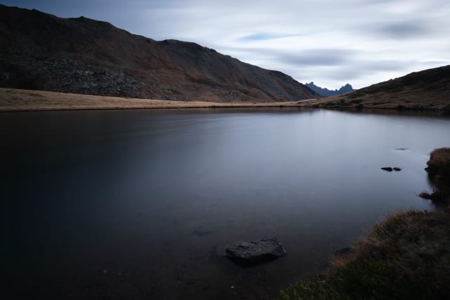 Long exposure is a well-known technique that has been used since the early days of photography.

As well as adding light, long exposure also creates special effects by changing the way we normally see things that move.

This 2-minute long exposure smoothes out the ripples on the surface of the lake.