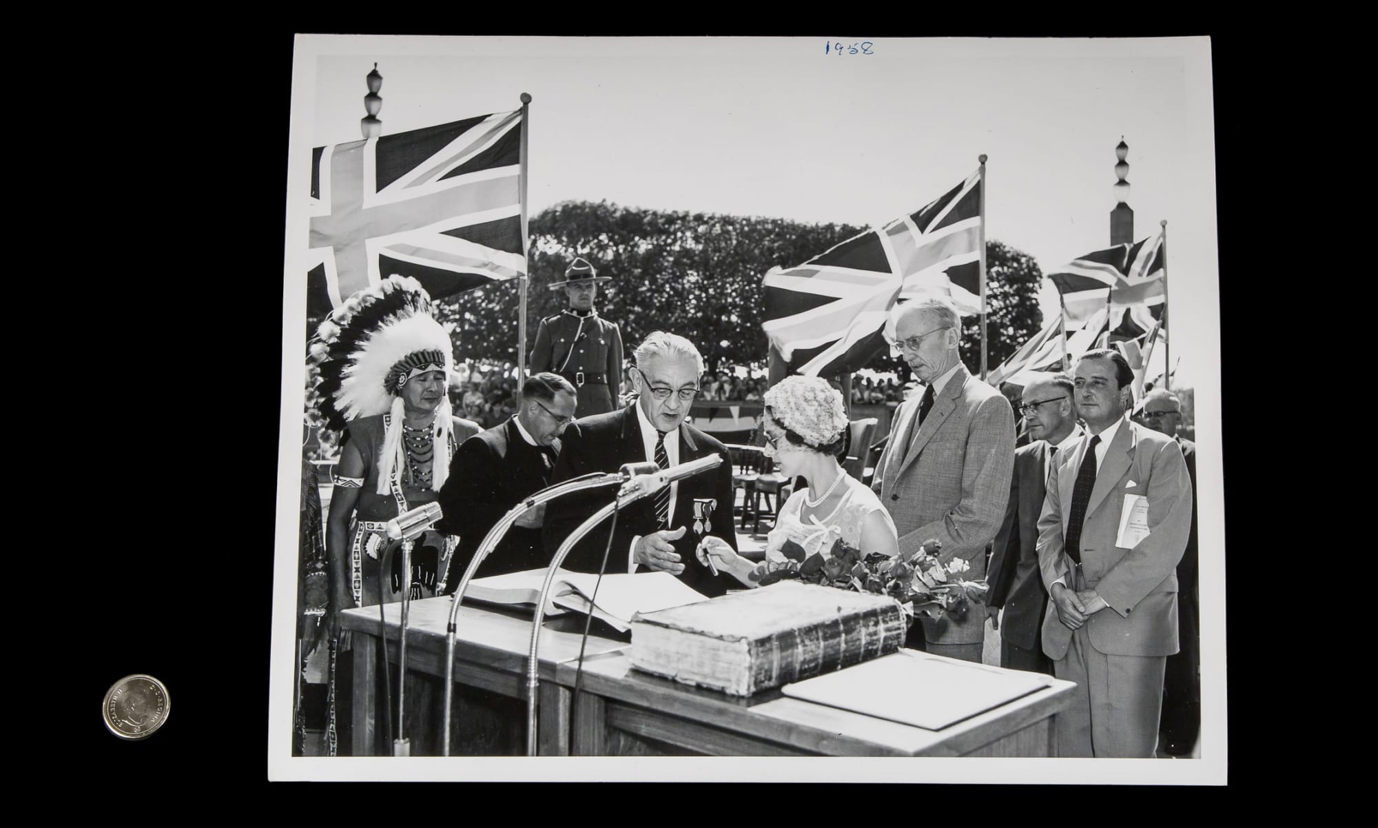 Princess Margaret signing a guest book in Niagara Falls