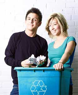 Couple holding a recycling box