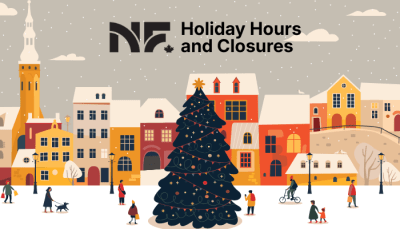 People walking around town with a large christmas tree and city of niagara falls logo 