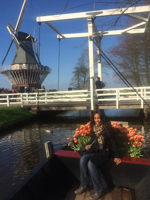 Me seated on a bench with the windmill behind