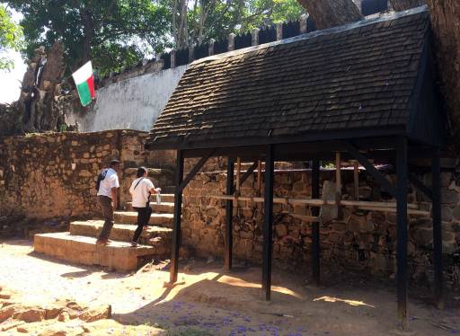 Stone fortress wall with the Madagascar flag flying