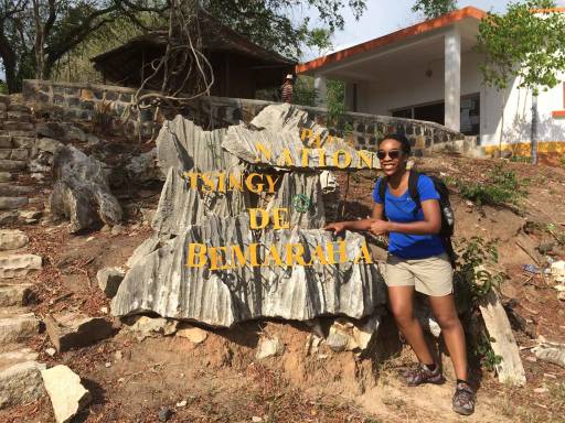 Me standing in front of the entrance sign of the national park