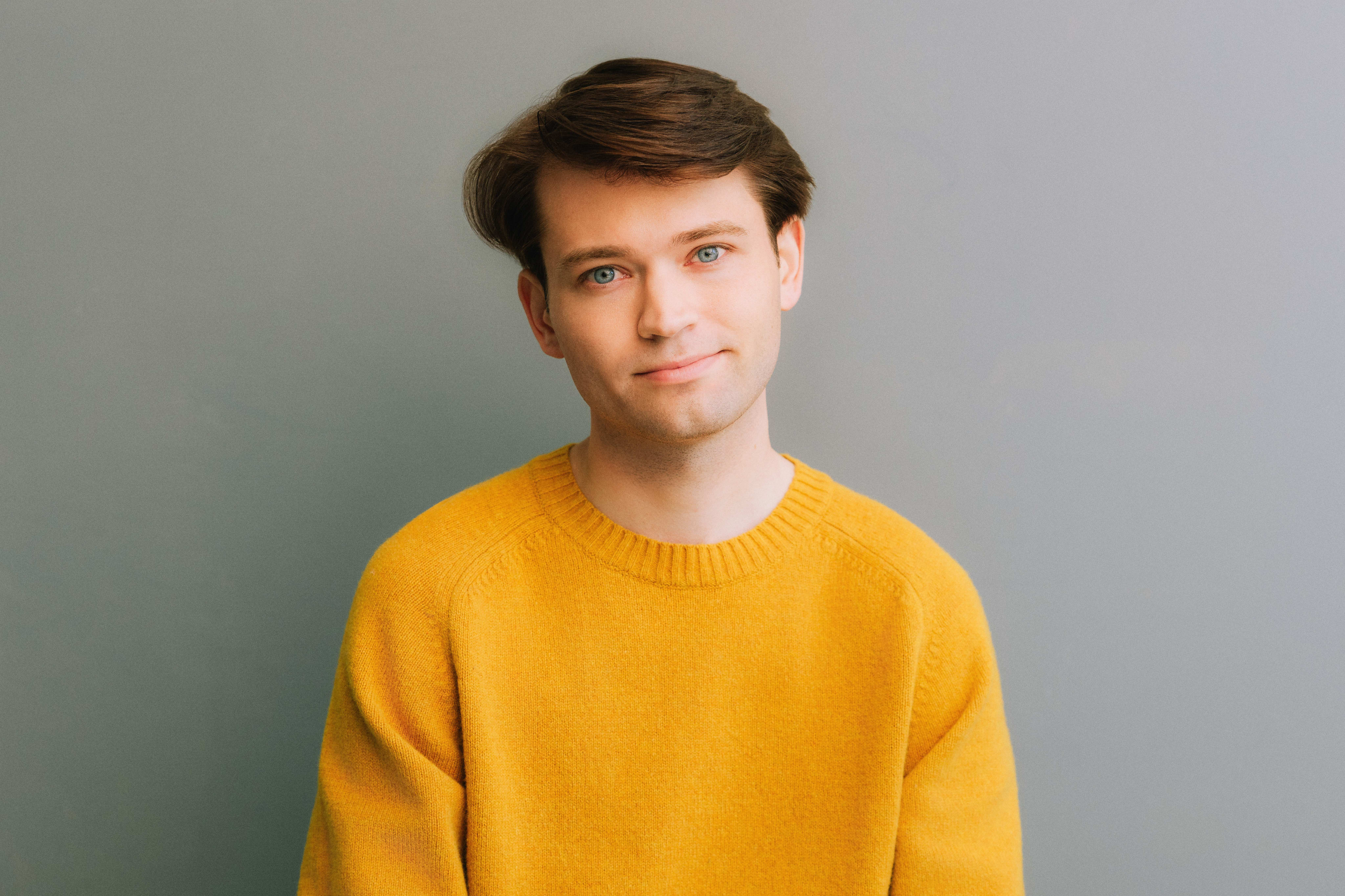 Headshot of Nick against a grey background