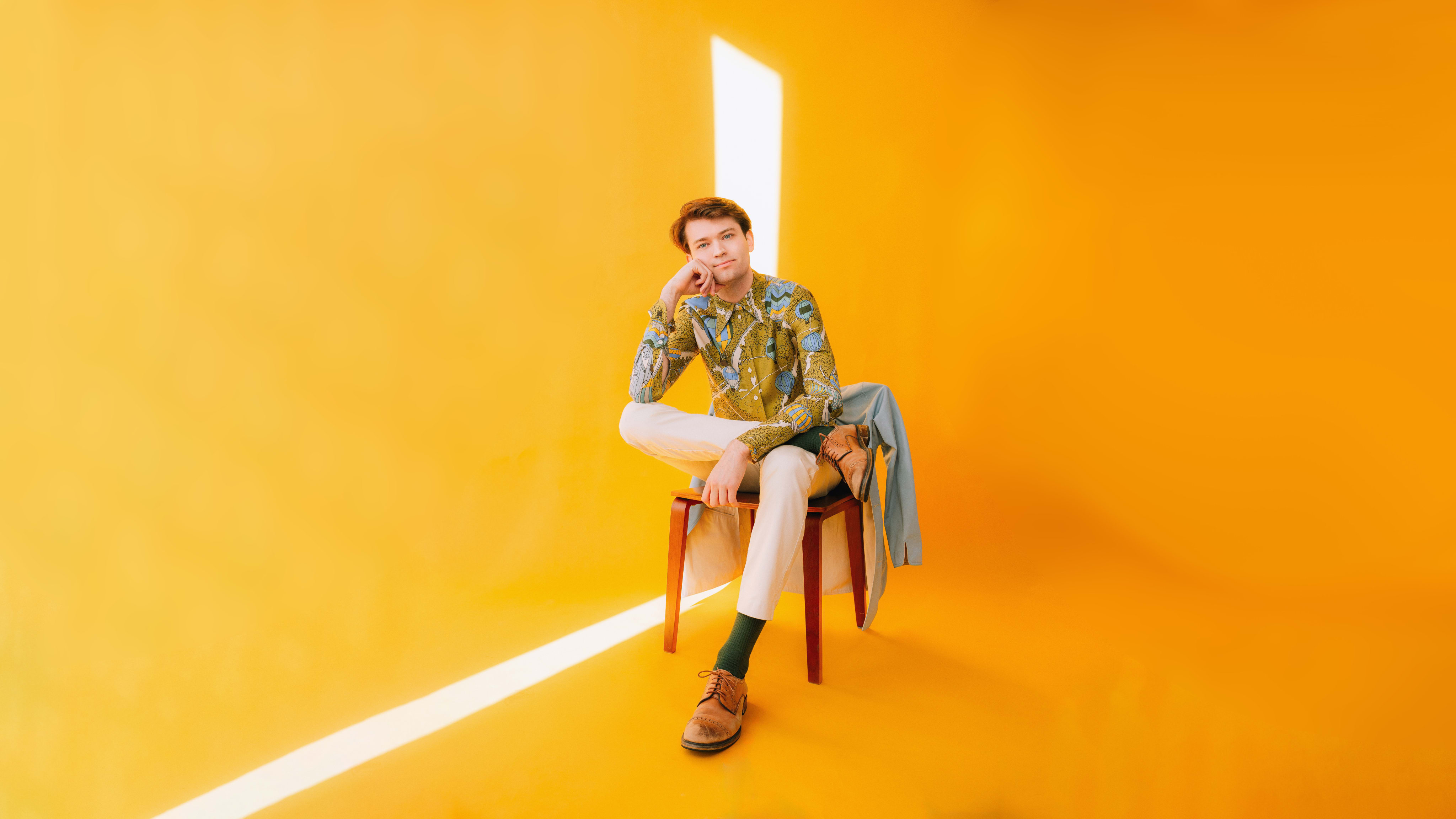 Nick Xitco, sitting in a chair