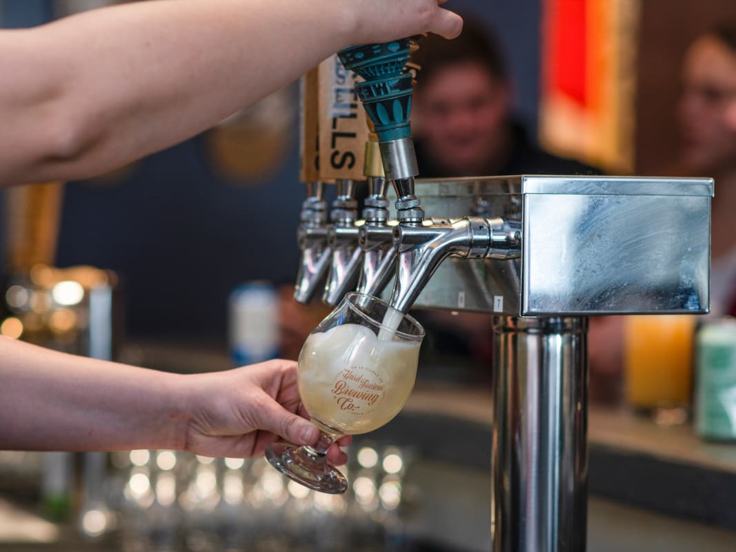 Craft Beer Pouring From Chrome Tap Handle Brewery Bar