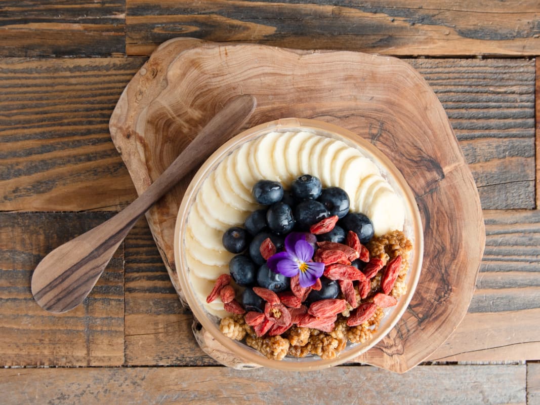 Healthy Acai Bowl Goji Berries Banana Blueberries Wooden Table