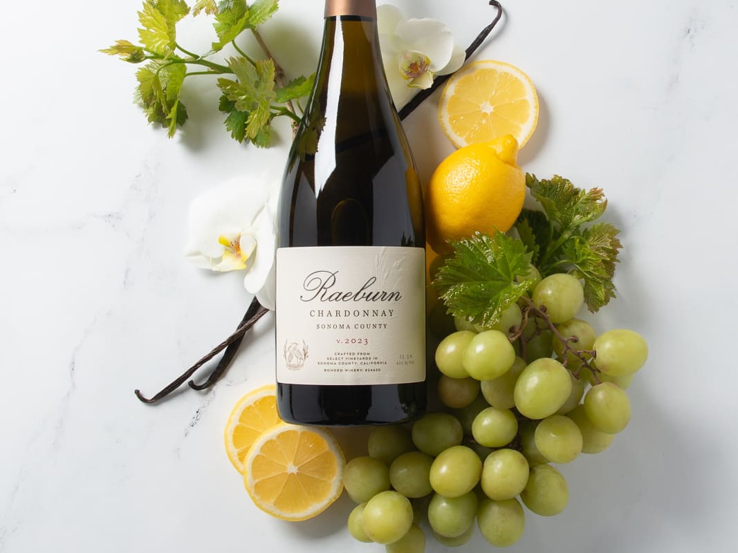 Raeburn Chardonnay Wine Bottle Grapes Elegant Flat Lay