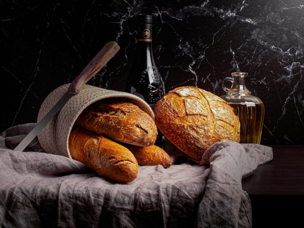 Artisan Bread Still Life Dark Marble Wine Bottles Rustic