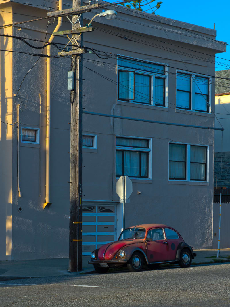 Vintage Red Volkswagen Beetle Golden Hour Urban Street