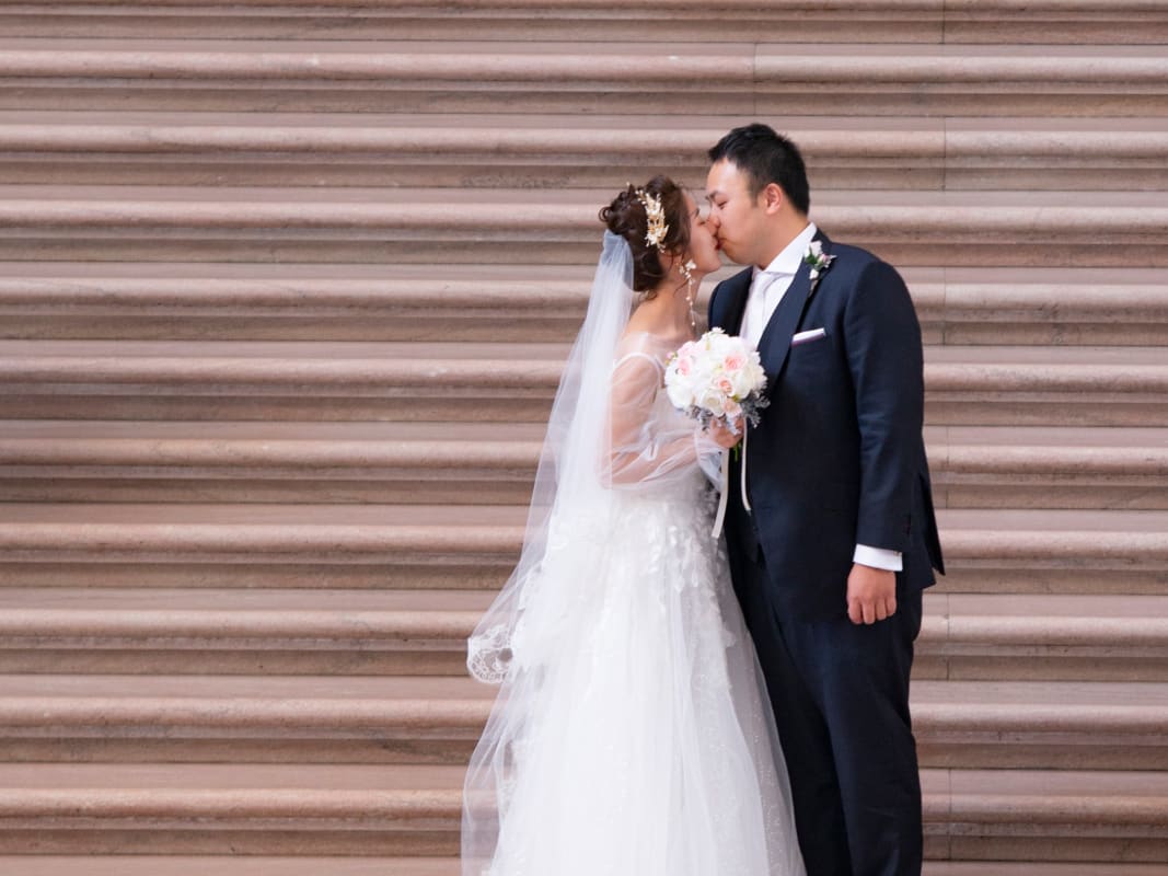 Romantic Wedding Couple Kiss Stone Steps White Gown Veil