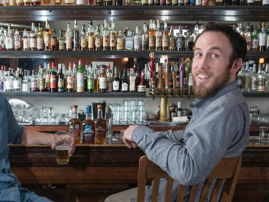 Two Men Whiskey Tasting Upscale Bar Interior