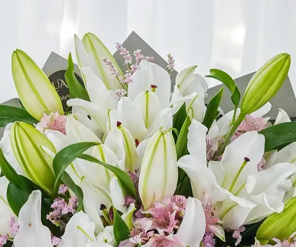 Hand bouquet of white lilies view 4