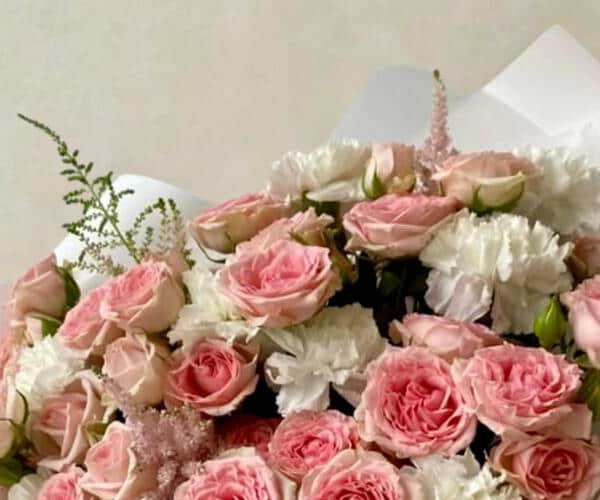 Pink rose bouquet with white wrapping view 2