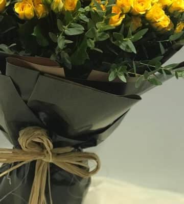 Yellow roses bouquet with eucalyptus wrapped in black paper N view 3