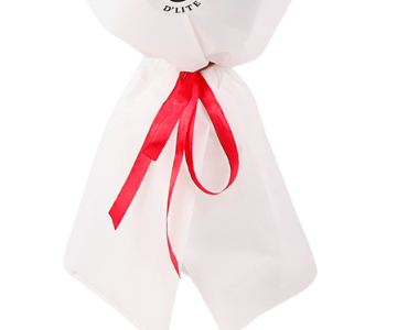 A bouquet of red roses with a white wrapper view 3