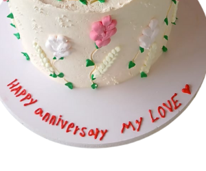 Beautiful cake decorated with white cream and pink roses view 3