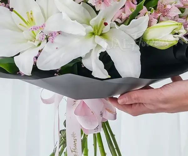 Hand bouquet of white lilies view 5