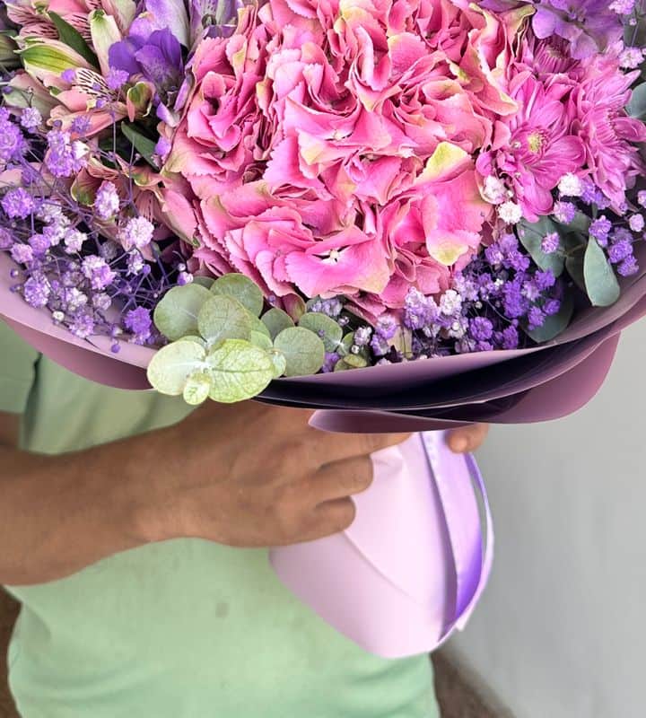 Assorted roses bouquet with purple wrapping view 3