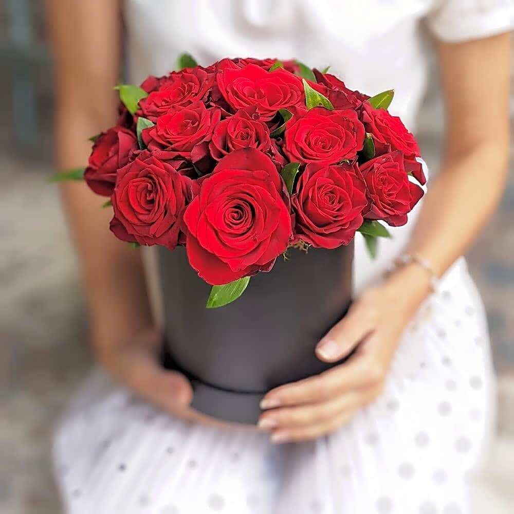 Maroon roses with eucalyptus in a black box view 1