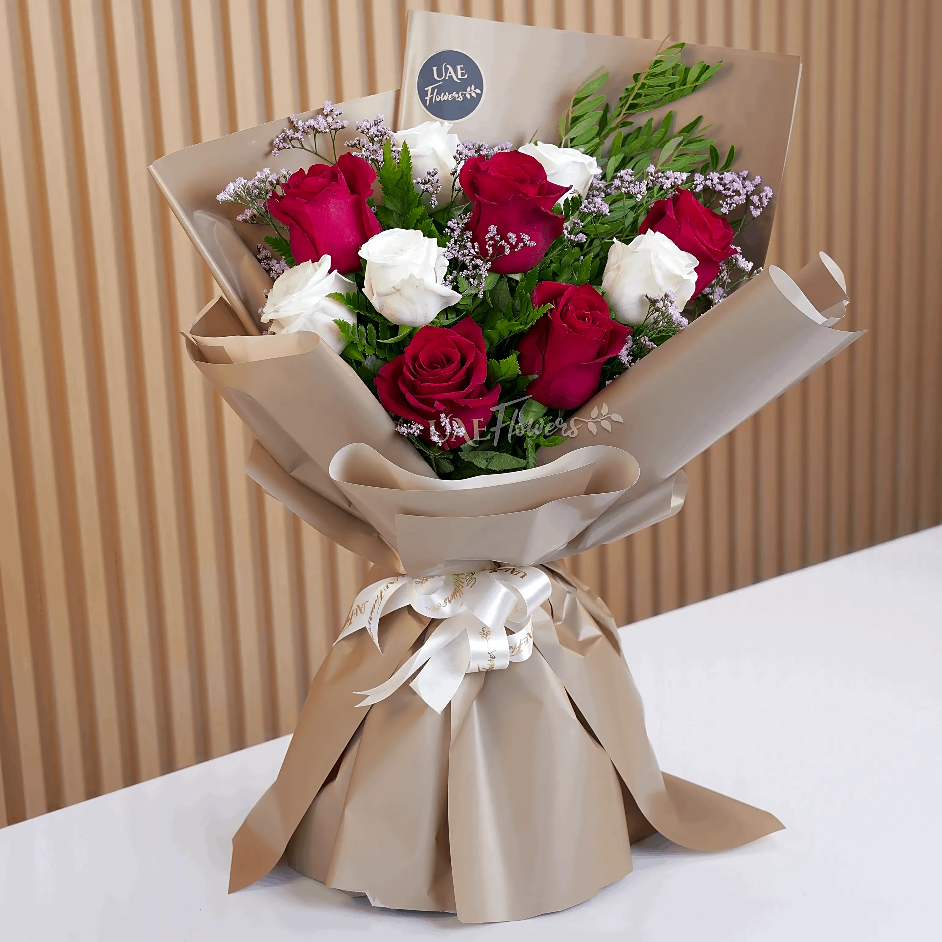 A white and red rose hand bouquet view 1