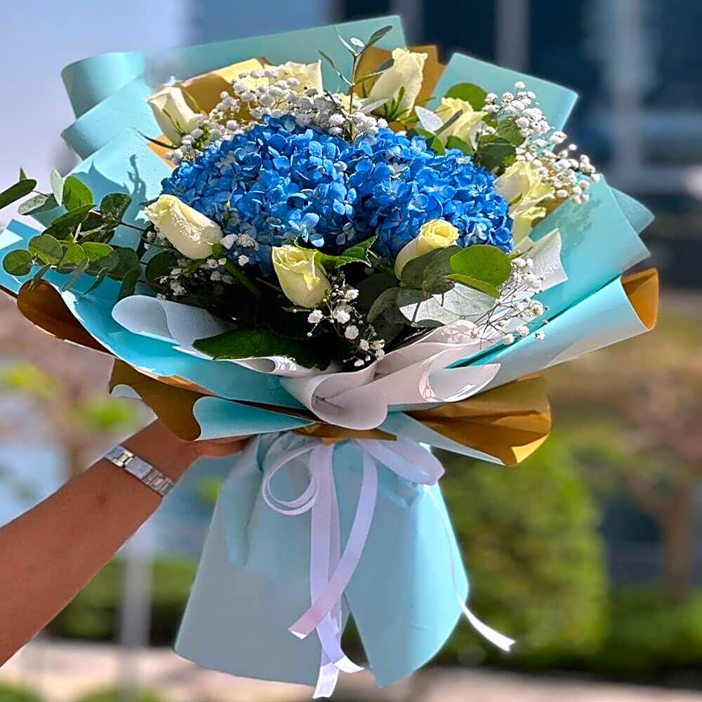 Blue hydrangea hand bouquet view 1