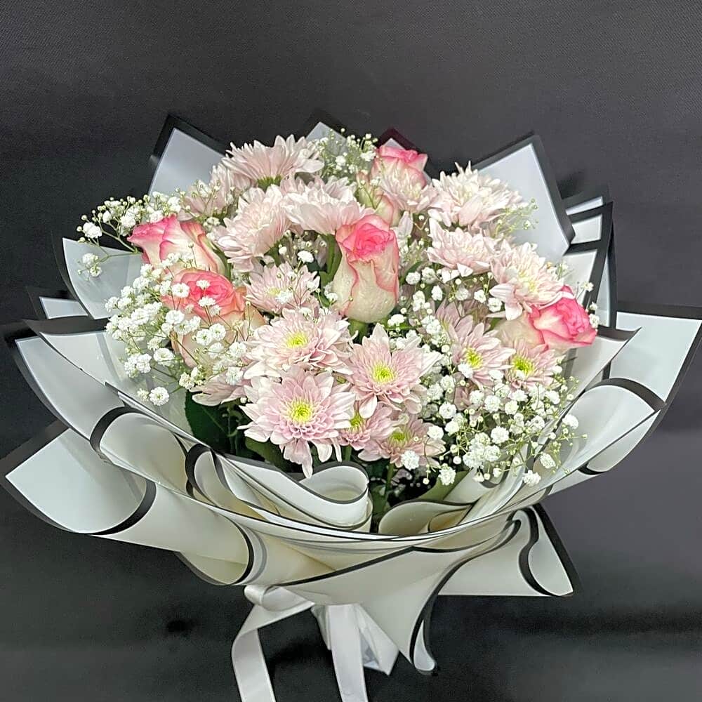 Pink rose bouquet with pink wrapping view 1