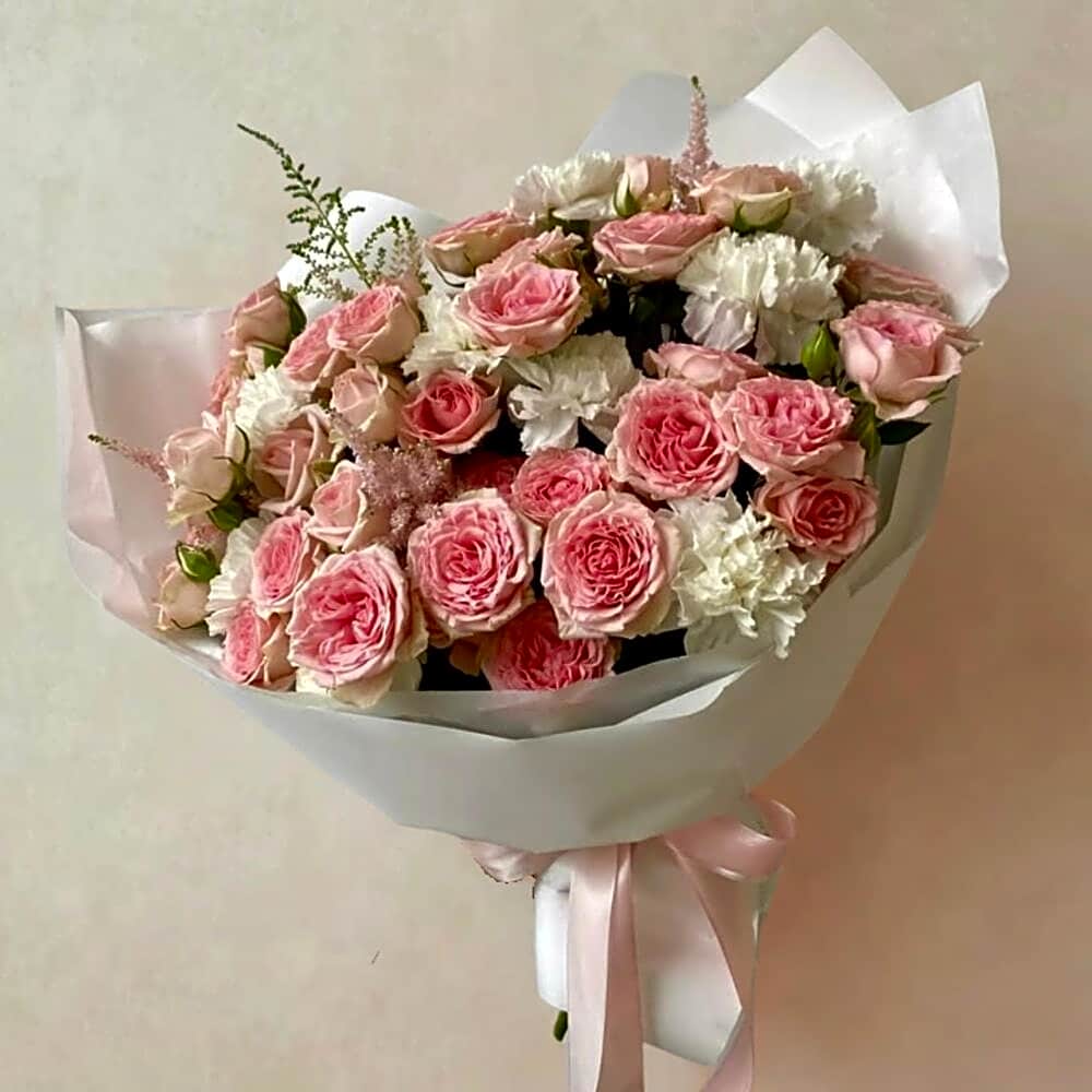 Pink rose bouquet with white wrapping view 1