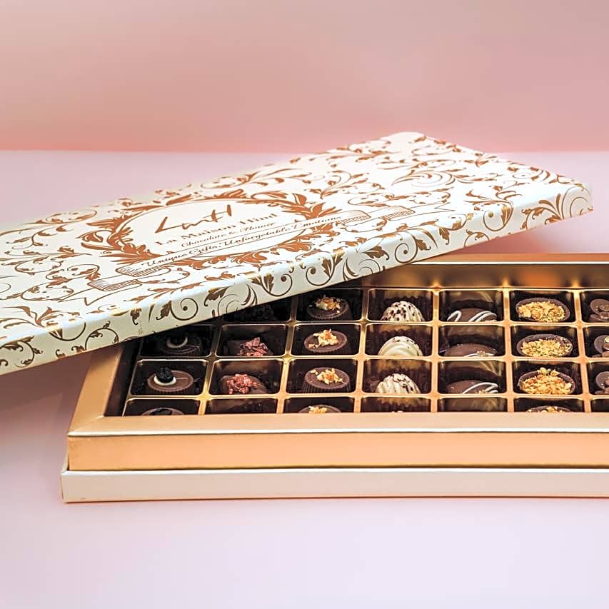 A luxurious chocolate box containing 36 filled egg candies and Nutella wafers, view 1