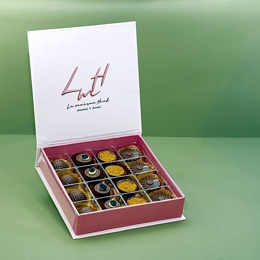 A luxurious chocolate box in an elegant pink color, featuring a sophisticated design that reflects luxury in every detail. view 1