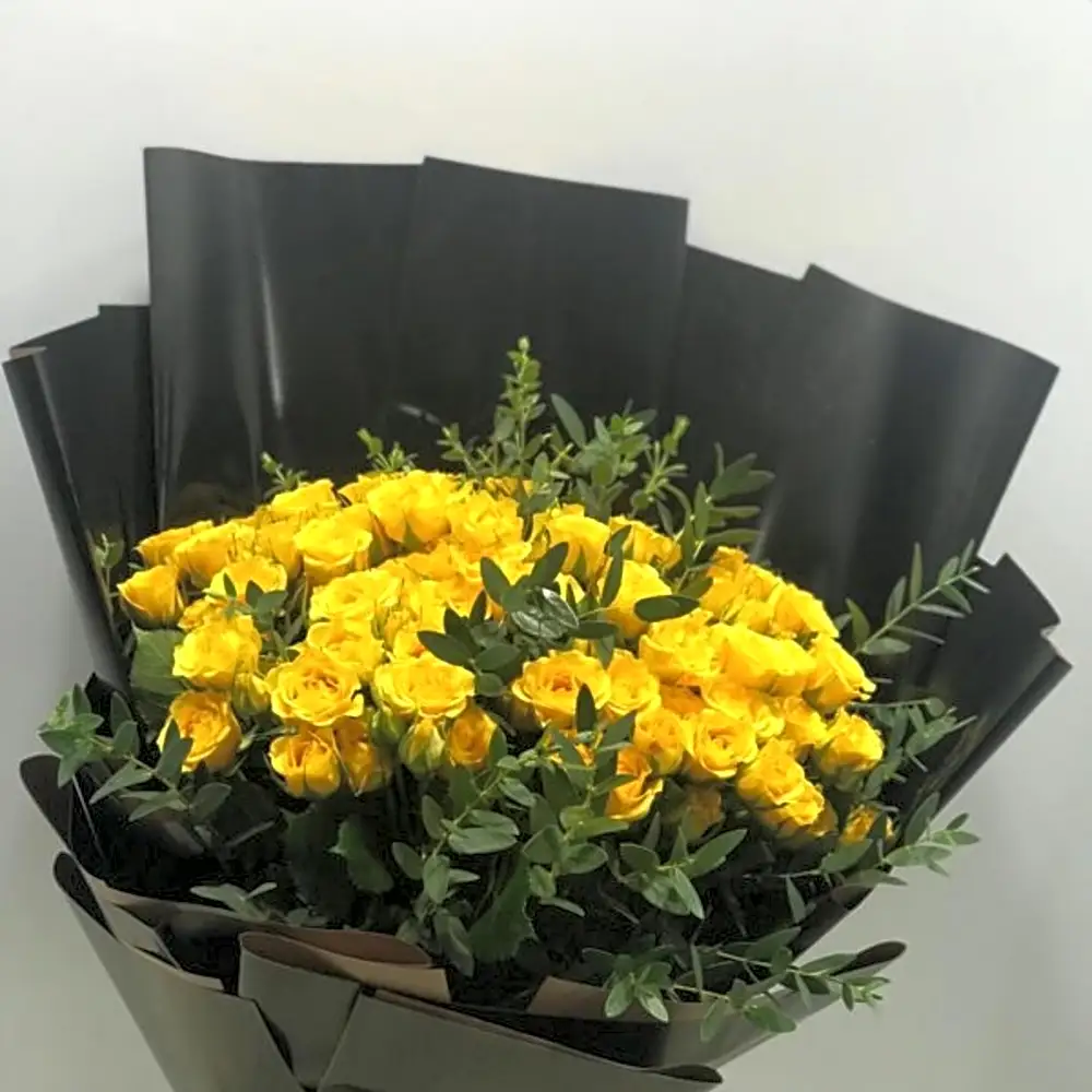 Yellow roses bouquet with eucalyptus wrapped in black paper N