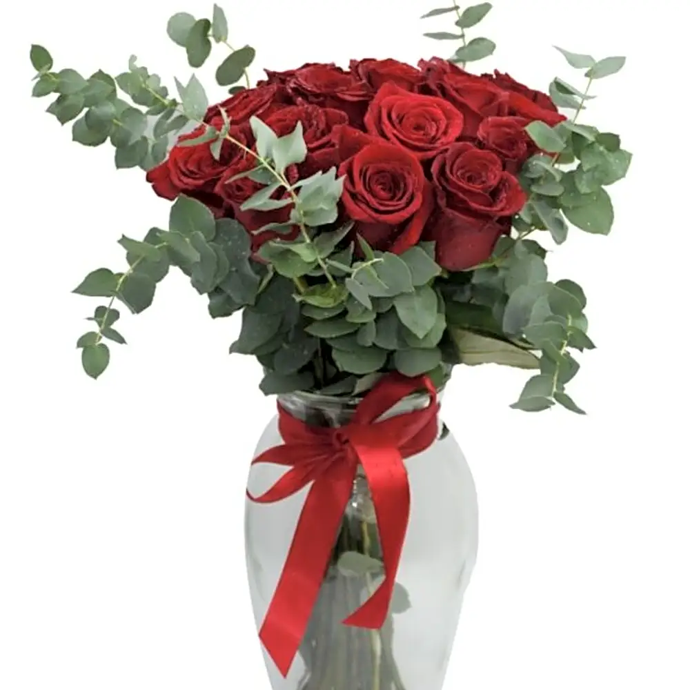 red roses and some eucalyptus with glass N