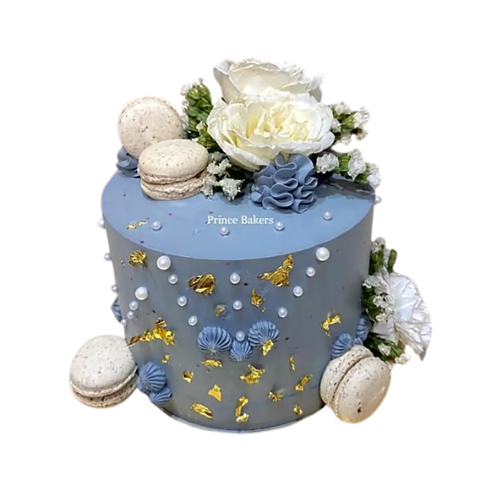 Belgian Chocolate Cake topped with fresh flowers and macrons