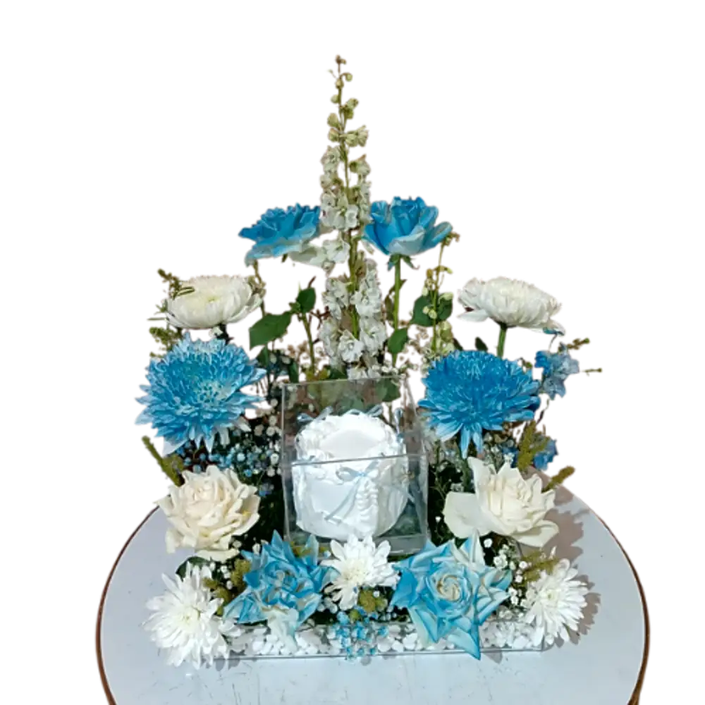 A tray of blue roses with white cake