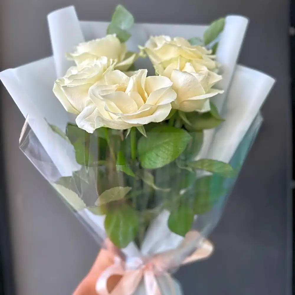 5 white roses and eucalyptus