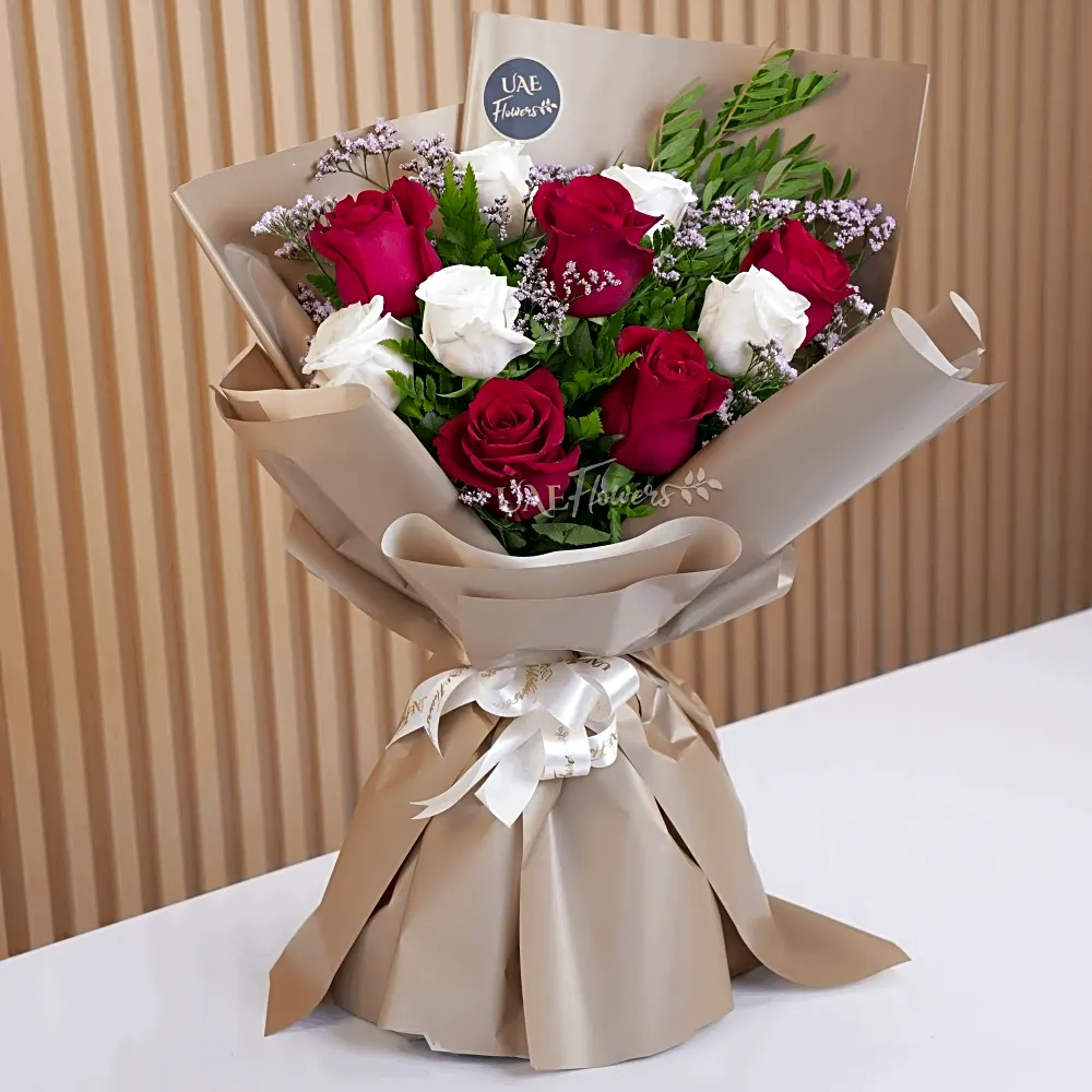 A white and red rose hand bouquet