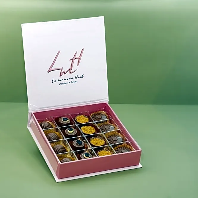 A luxurious chocolate box in an elegant pink color, featuring a sophisticated design that reflects luxury in every detail.