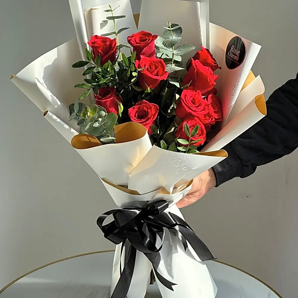 Red roses bouquet with leaves and gypso roses
N