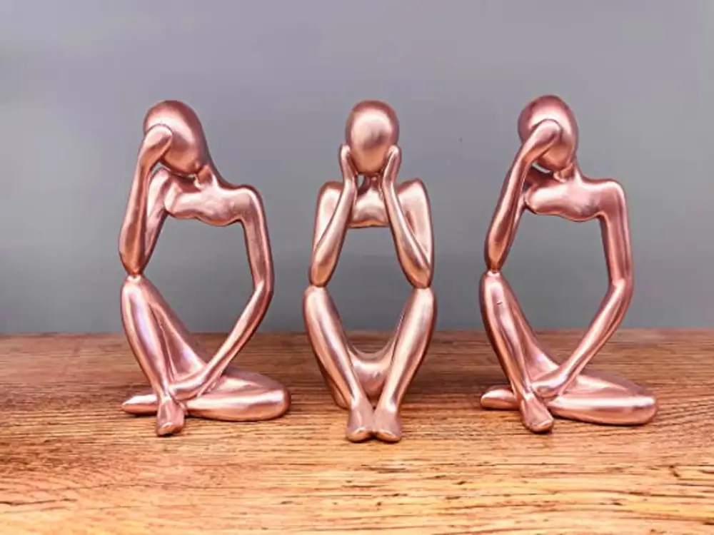 The thinker statue consists of 3 decorations in an abstract sculpture style