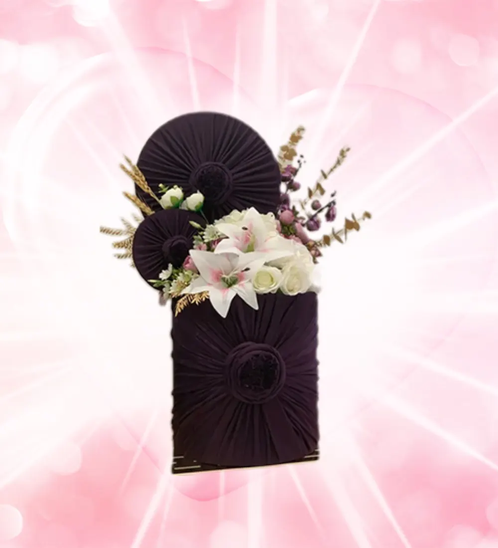 A masterpiece wrapped in a stretch fabric with artificial roses