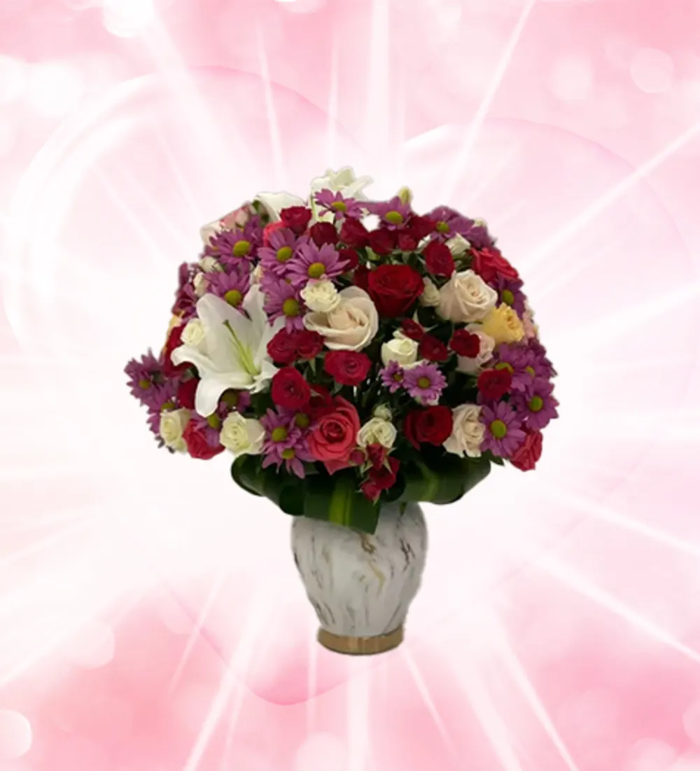 Marble vase in a circular arrangement of roses