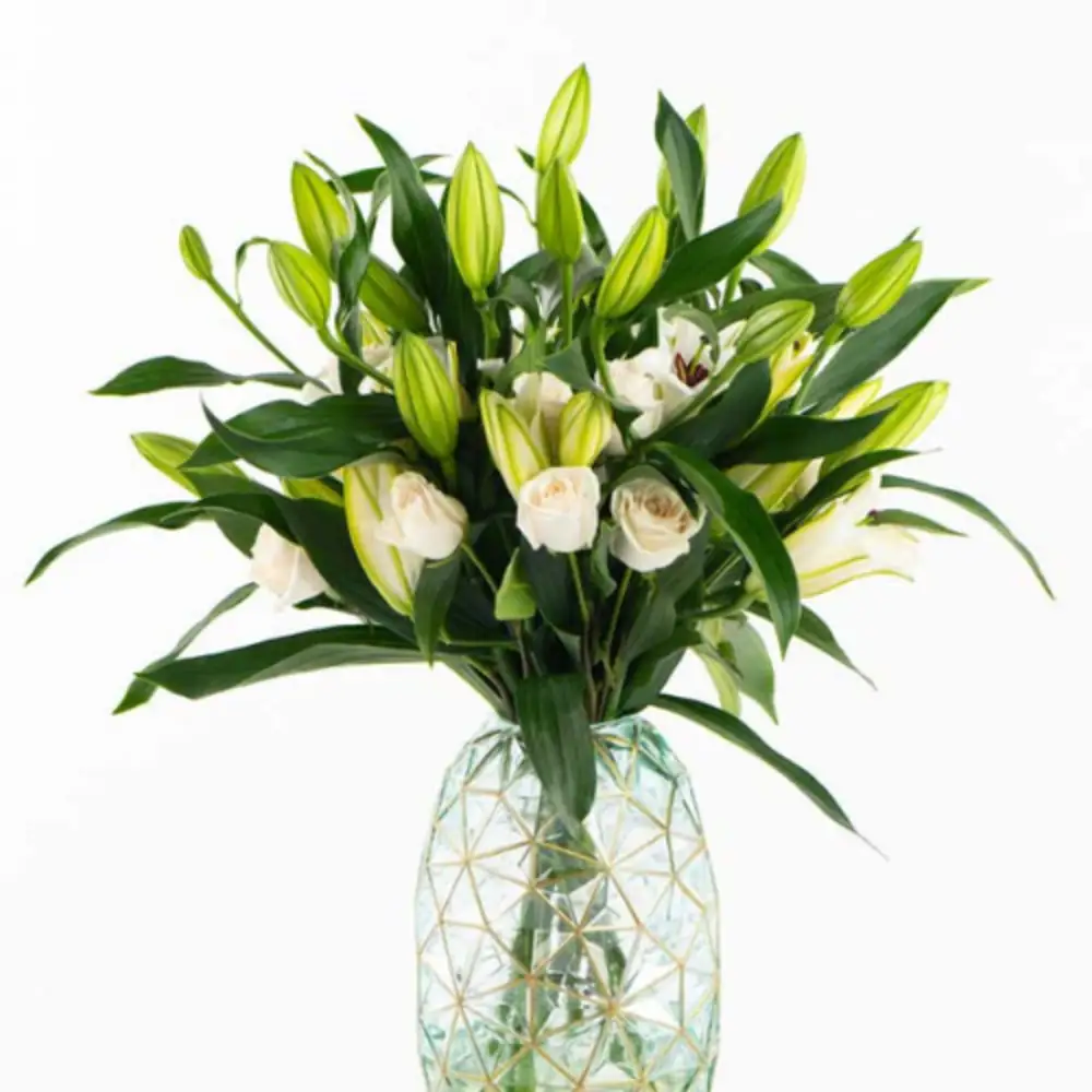 Transparent vase arrangement lily white